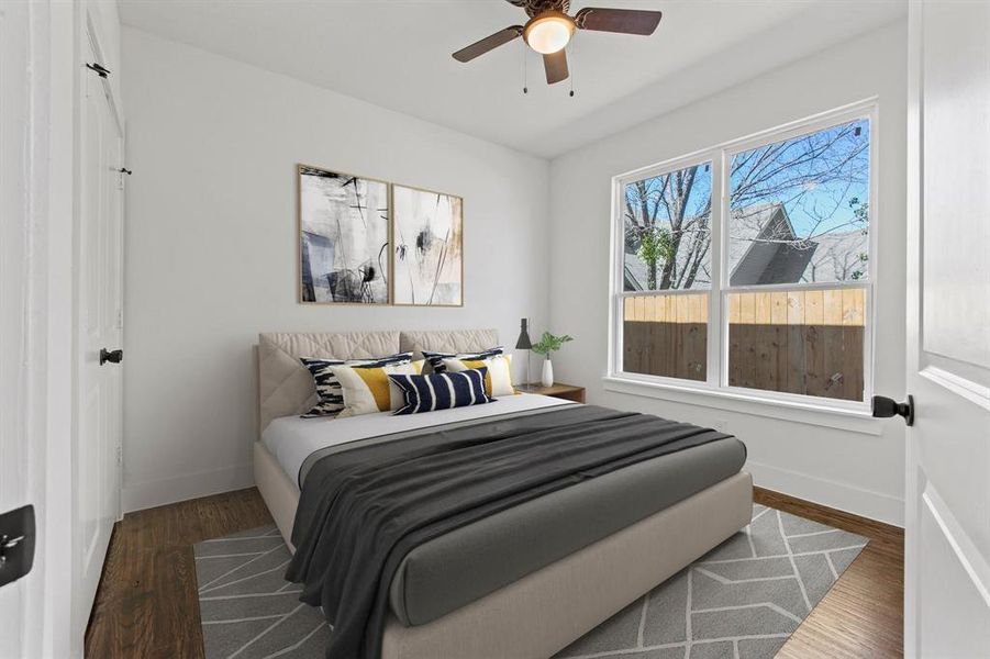 Bedroom with dark hardwood / wood-style flooring and ceiling fan