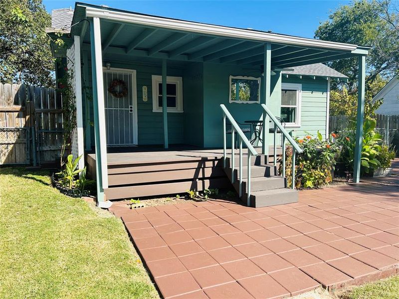 Covered Porch with Steps to Patio.