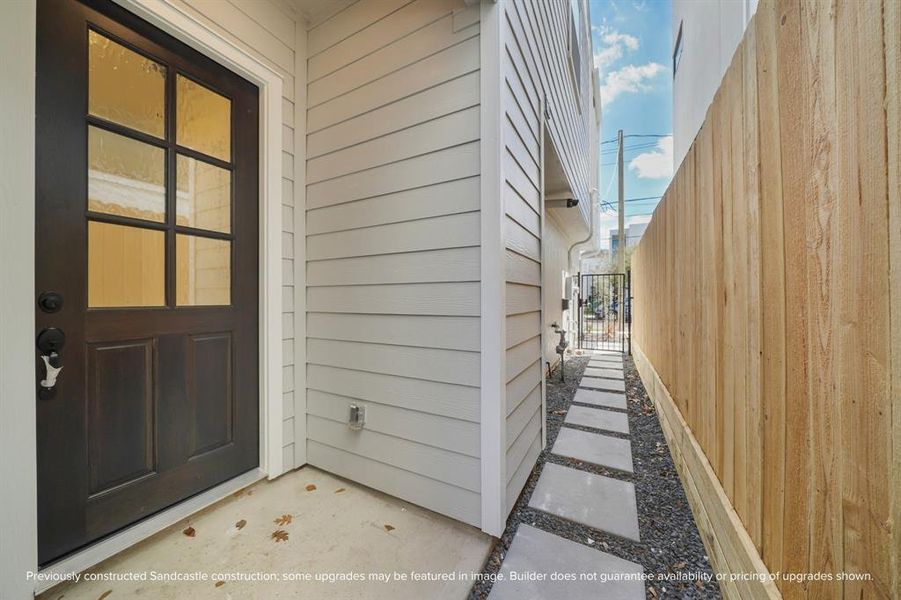 Enjoy the peace of mind with a gated entry and private walkway leading to the front door of your new home.