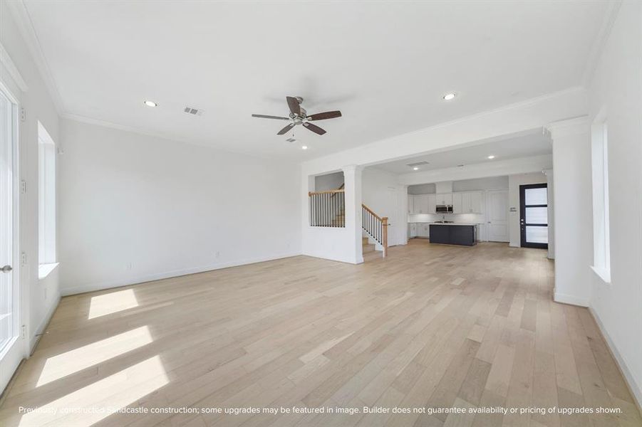 At the heart of the home, this vast living room offers endless possibilities for relaxation and entertaining.