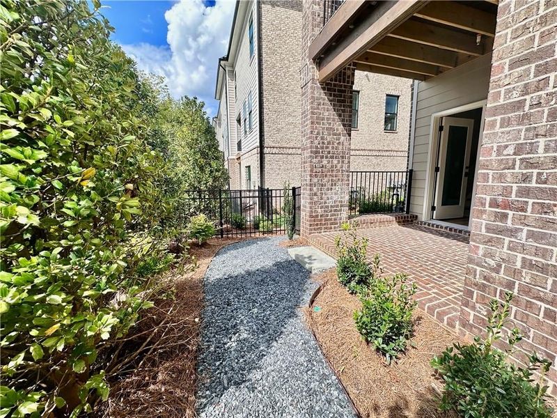 Terrace level patio complete with fenced in backyard with HOA maintained landscaping