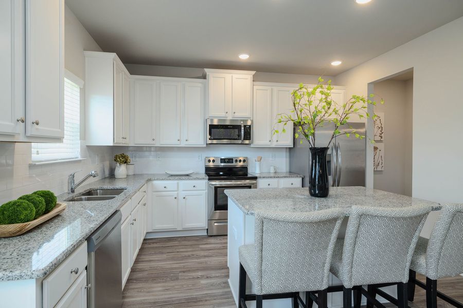 Gourmet kitchen with large island, walk-in pantry and adjoining breakfast area