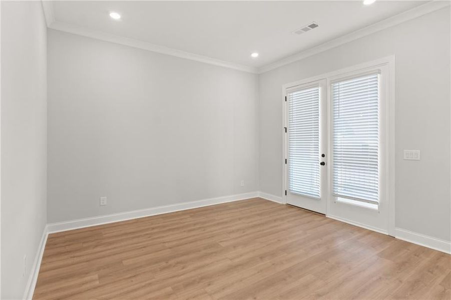 The dining area adjacent to the kitchen is bathed with natural light from the French doors that lead to the rear deck. NOT actual home. Photos of previously built Grayton floorplan.