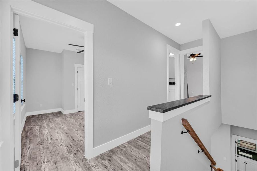 Hall featuring light hardwood / wood-style flooring