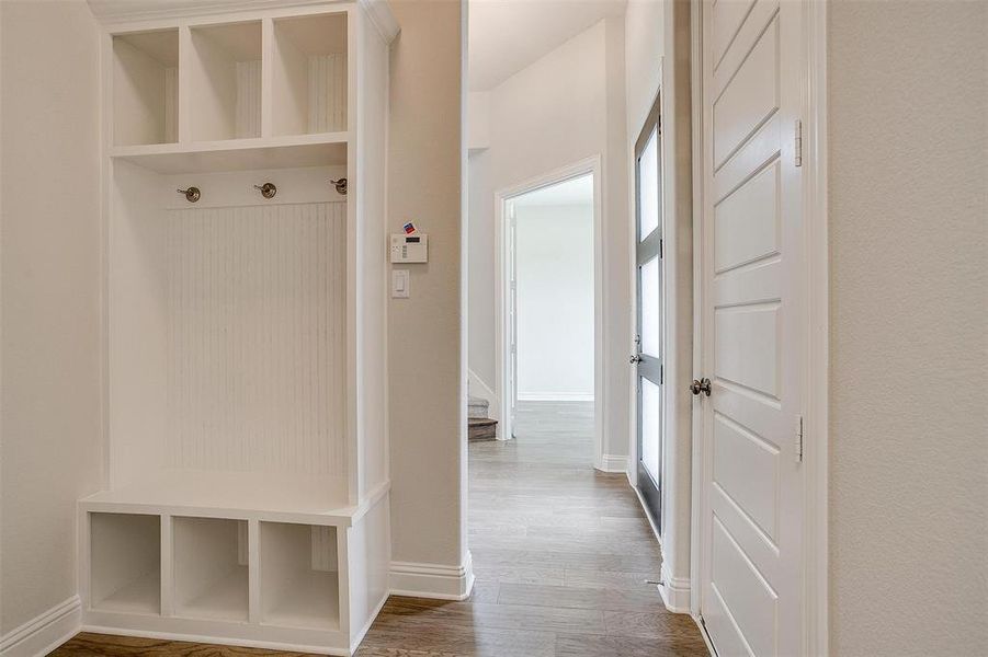 Mudroom featuring wood-type flooring