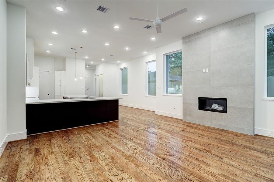 View of living room with statement fireplace - Attention to detail found throughout.