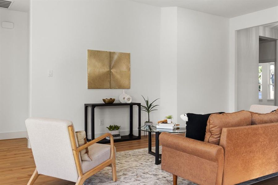 Living room with hardwood / wood-style floors