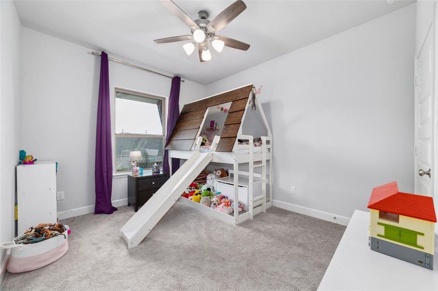 This bedroom is to the right of  the stairs, has a large window for ample light. It is connected to a Jack and Jill Bathroom that is connected to another bedroom. This bed can stay with the home.