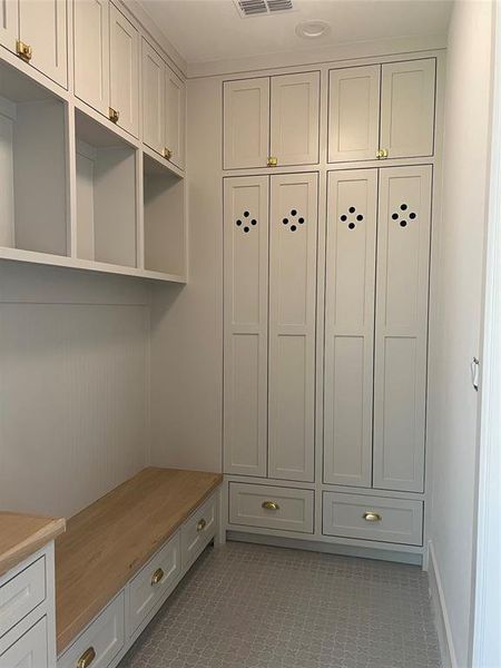 MUD room with built ins.