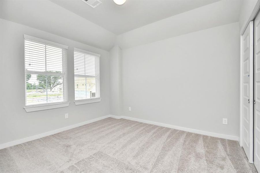 Generously sized secondary bedrooms, complete with spacious closets and soft, inviting carpeting.