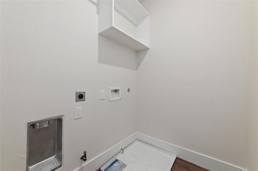 Conveniently Located Laundry Room Is Great For That Extra Storage As Well. Shelving Keeps Everything Organized And Easy To Get To