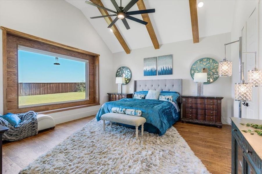 Bedroom featuring high vaulted ceiling, ceiling fan, beamed ceiling, and hardwood / wood-style flooring