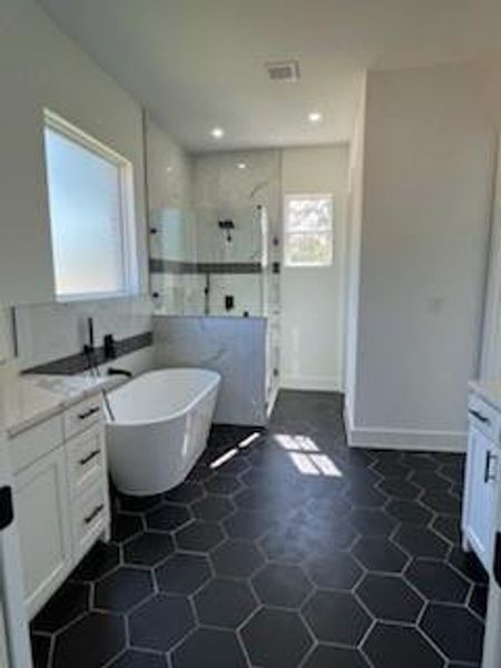 Bathroom with shower with separate bathtub, tile patterned floors, and vanity