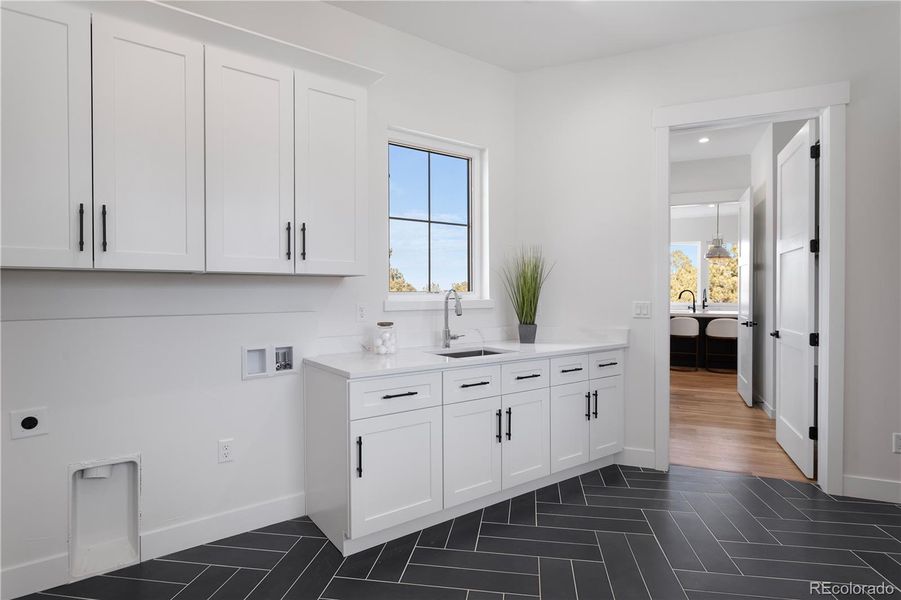 Oversized laundry room with built-in storage
