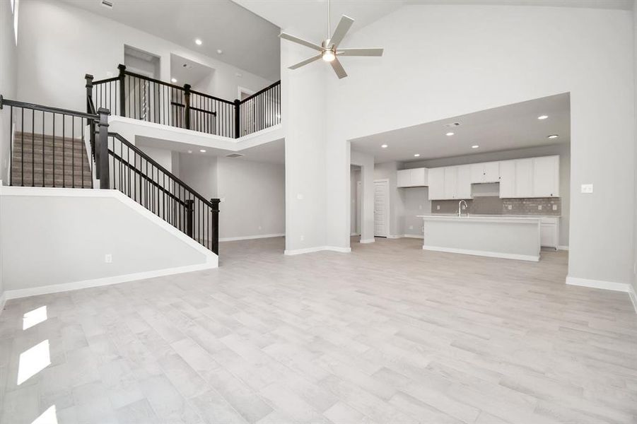 Another view of family room. Sample photo of completed home with similar floor plan. As-built interior colors and selections may vary.