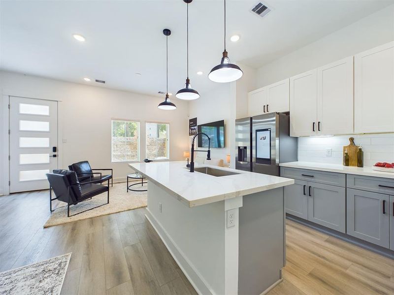 This attractive Kitchen is full of beautiful details. Quartz Countertops, Stainless steel Sink, Stainless Steel Appliances, Recessed Lighting, Undercabinet Lighting, Elegant Cabinetry with Soft Close Drawers and Doors