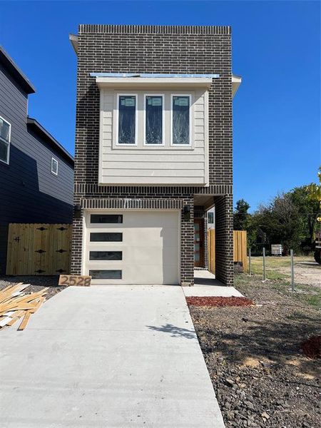 View of front of house with a garage