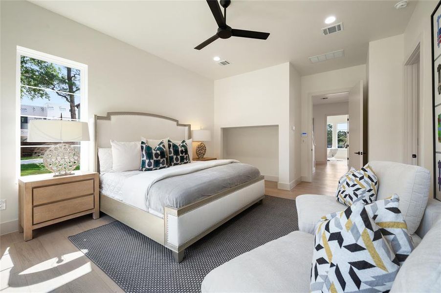 Bedroom featuring light wood-type flooring and ceiling fan