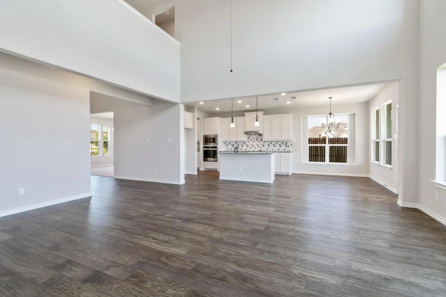 Family Room & Kitchen | Concept 3115 at Massey Meadows in Midlothian, TX by Landsea Homes