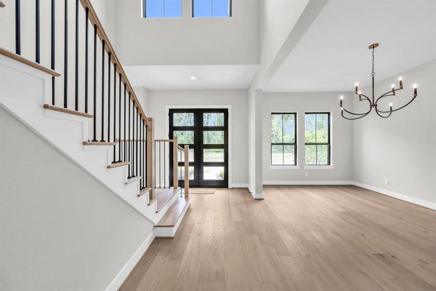 View of the double front door entry and dining room