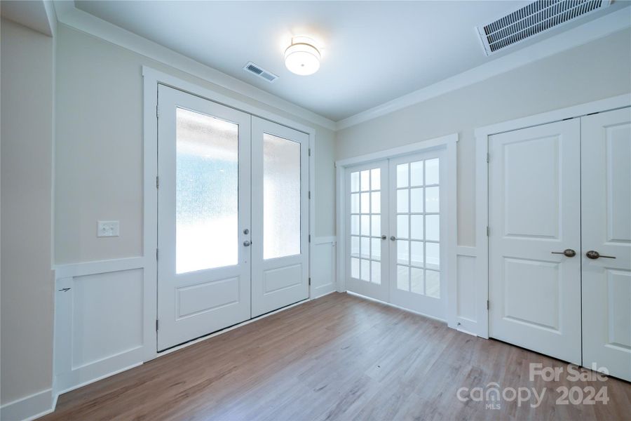 Welcoming foyer with double front doors