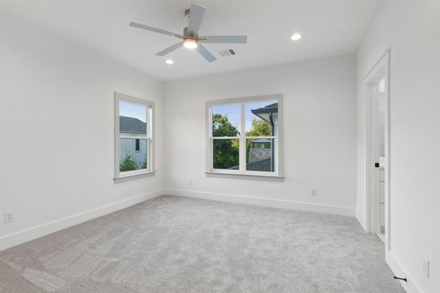 Unfurnished room with light carpet and ceiling fan