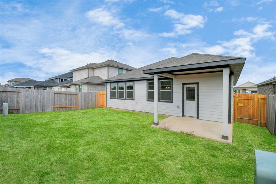 This outdoor area is the perfect canvas for your dream living space, featuring ample room for patio furniture, a BBQ pit, and limitless opportunities to design your own personal oasis.