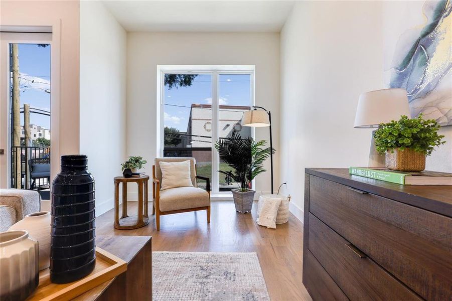 Sitting room featuring light hardwood / wood-style floors