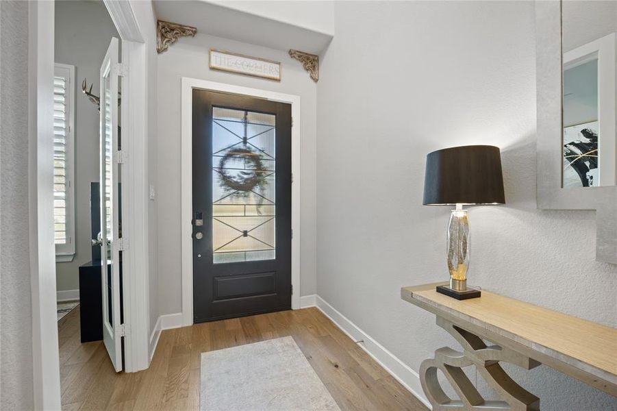 Foyer with light wood-type flooring