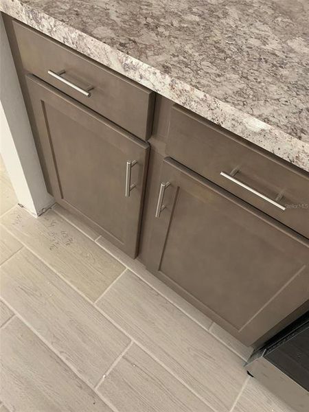 Actual cabinets, countertops and tile flooring