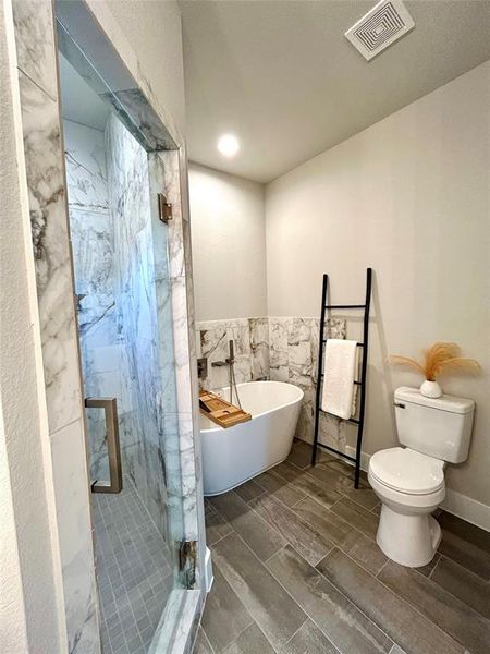 Separate shower/tub in the primary bathroom.