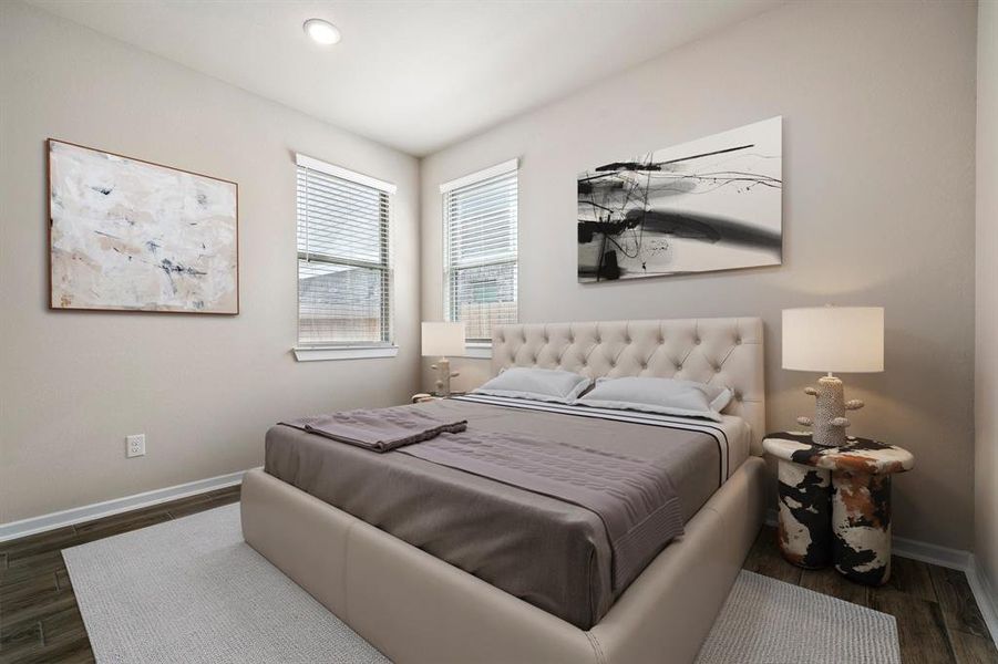 Secondary bedroom features wood flooring, neutral paint, recessed lighting and large windows with privacy blinds.