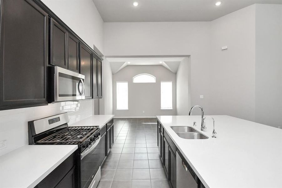 Beautiful kitchen with built-in stainless steel appliances