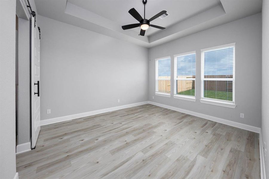 Purposefully tucked away in the back corner of the home for privacy, the master bedroom offers a tranquil space to unwind.