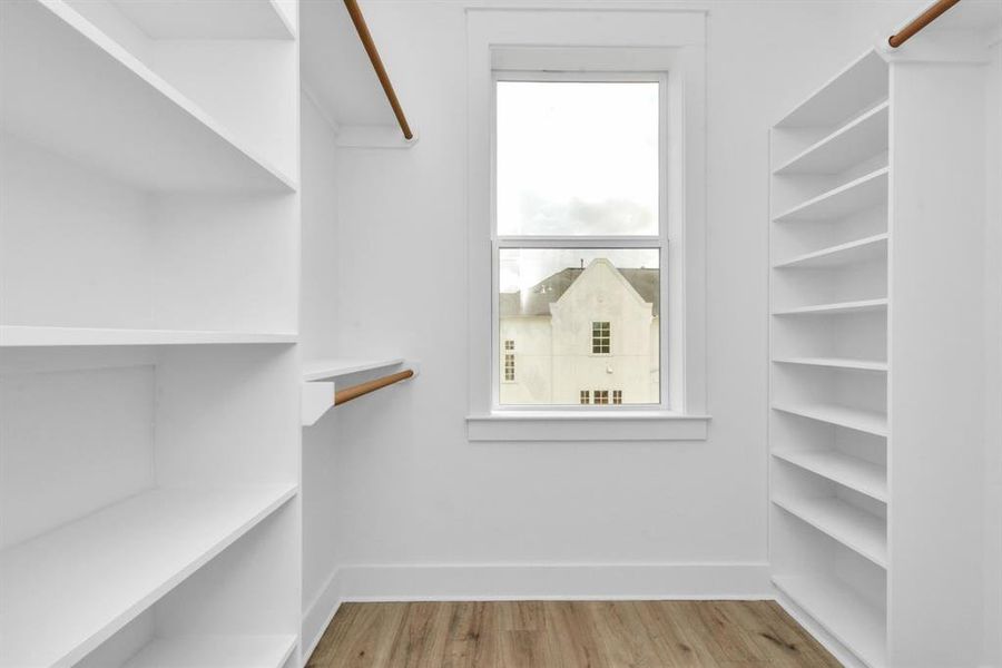 Versatile second closet in primary room, potential study nook, maximizing space for work or relaxation.