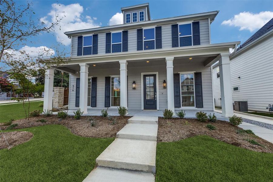 View of front facade featuring a porch, central AC unit, and a front lawn