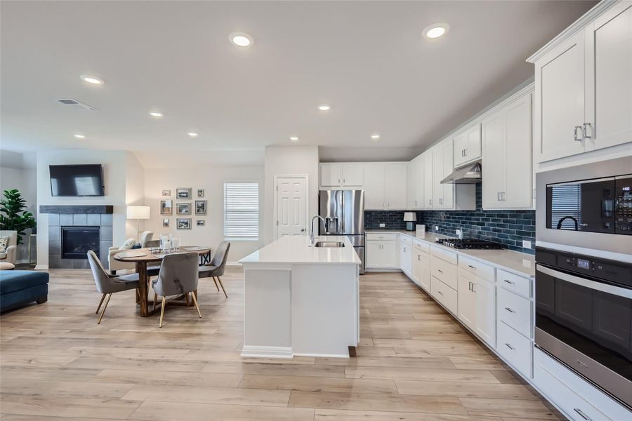 The kitchen is open to a large, dining area with enough room for a grand table, while still being cozy enough for a smaller table - you choose!