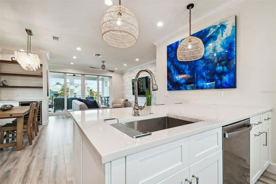 Kitchen opens to family room/dining space.