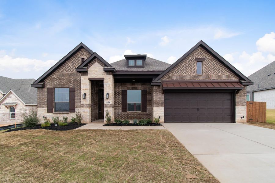 Elevation C with Stone | Concept 2533 at Abe's Landing in Granbury, TX by Landsea Homes