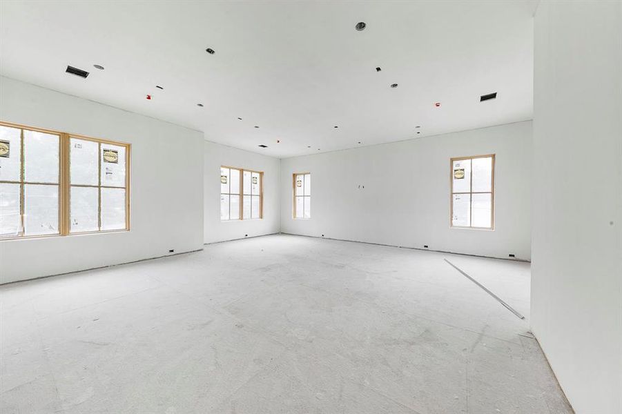 This expansive flex space/game room area located on the second floor offers endless possibilities. A full wet bar will be installed with fridge and sink. The room will be painted a dark moody color to create a fun movie ambiance if you would like to convert this room to a family theater.