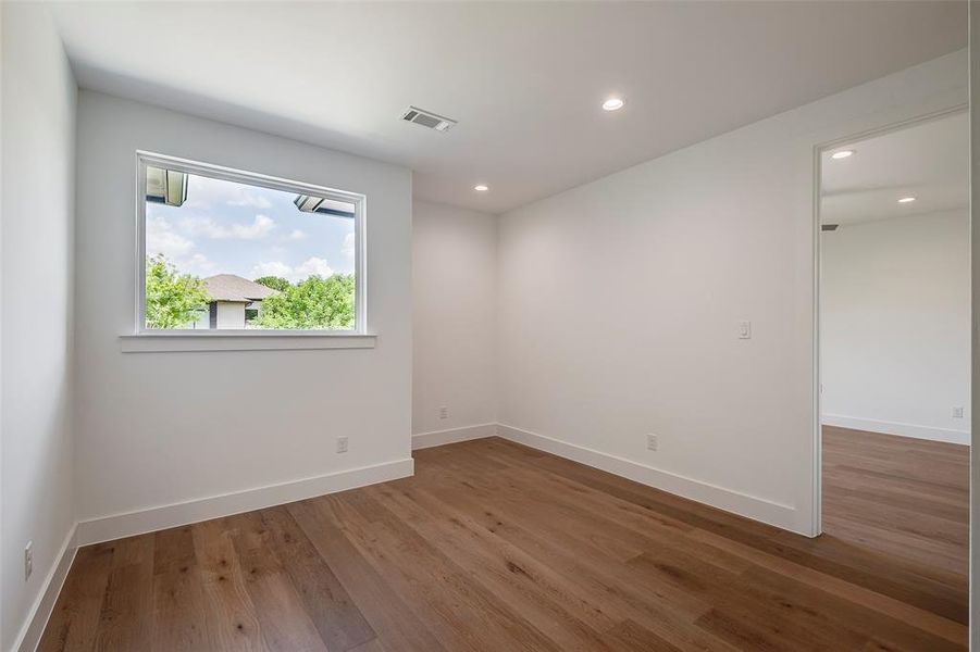 Loft room with hardwood / wood-style floors