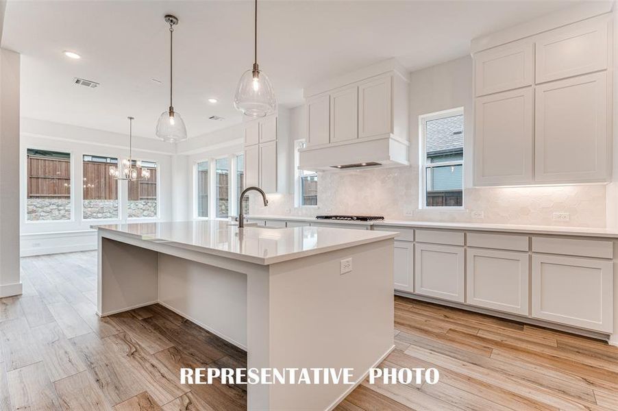 Featuring tons of storage, fantastic finishes and great natural light, the kitchen of your dreams awaits! REPRESENTATIVE PHOTO.