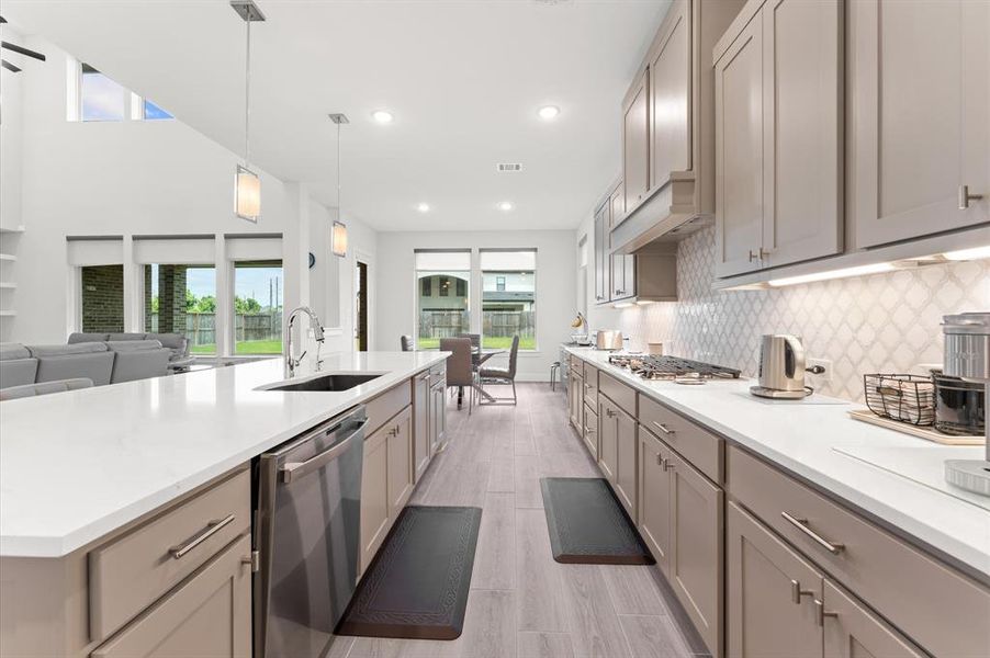 Stainless steel appliances and the open layout to the breakfast area make this kitchen both stylish and practical.