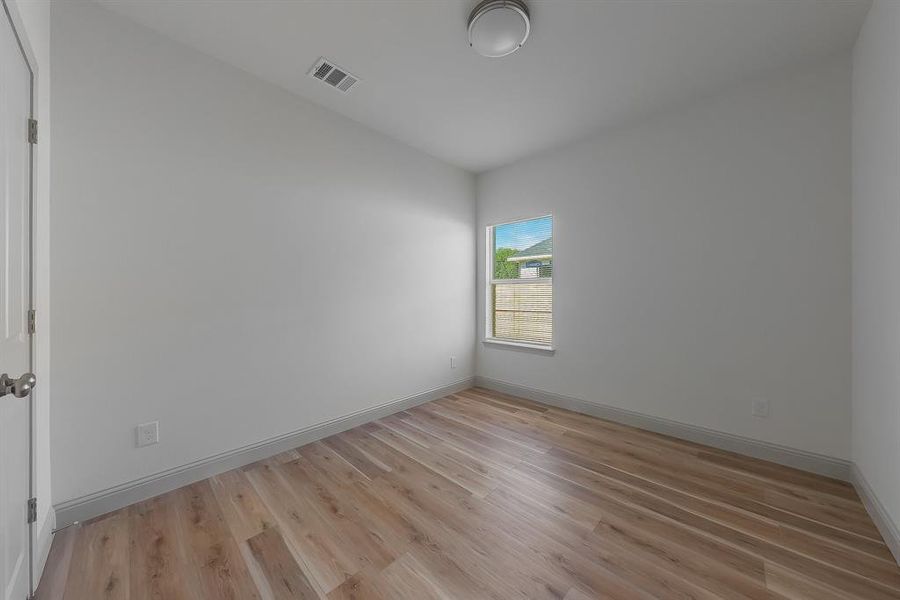 Empty room with light wood-type flooring