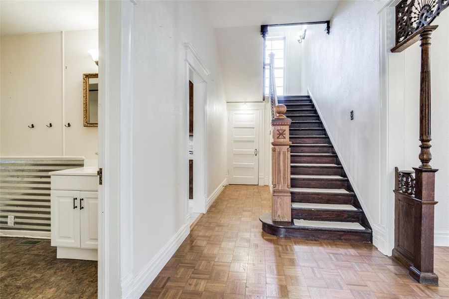 Stairway featuring parquet floors