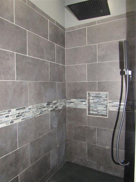 walk in master shower with overhead rain head and body spray