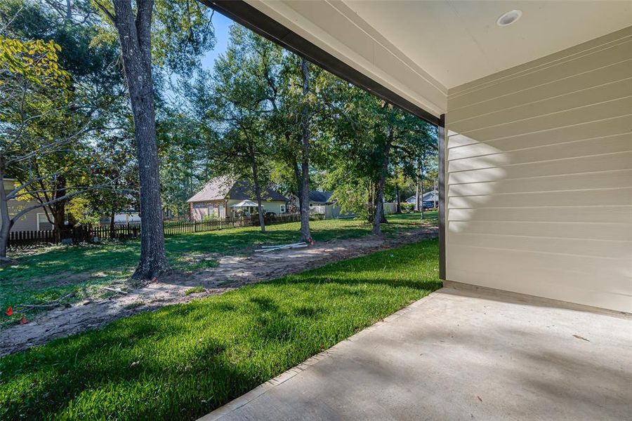Step outside to the covered patio and take in the serene surroundings. With a 2-car attached garage, convenience meets luxury in this lakeside retreat.