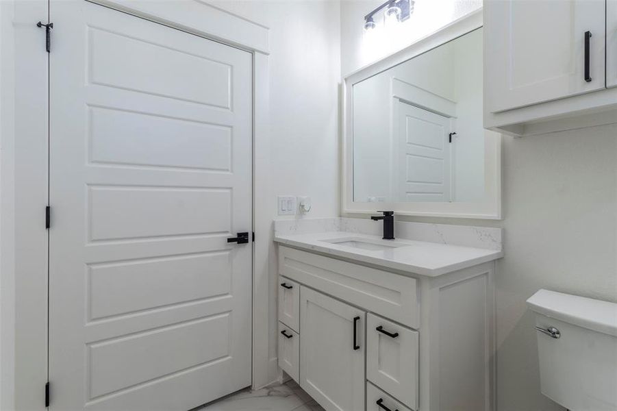 Bathroom with vanity and toilet