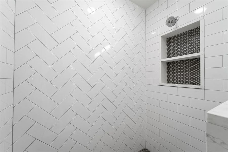 Bathroom with a tile shower