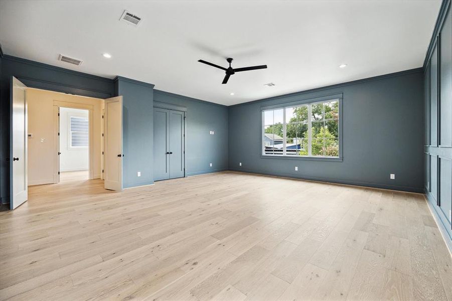 The gameroom features double doors that lead to the second floor hallway and a closet.